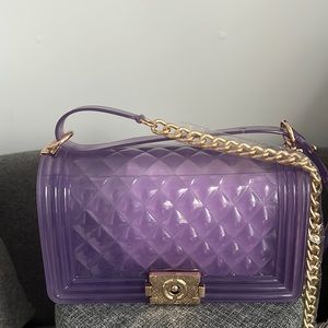 Purple couch and crossbody bag